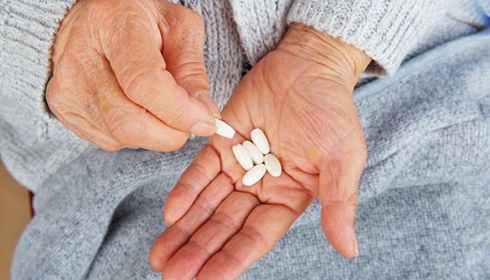 lady holding white zinc tablets 