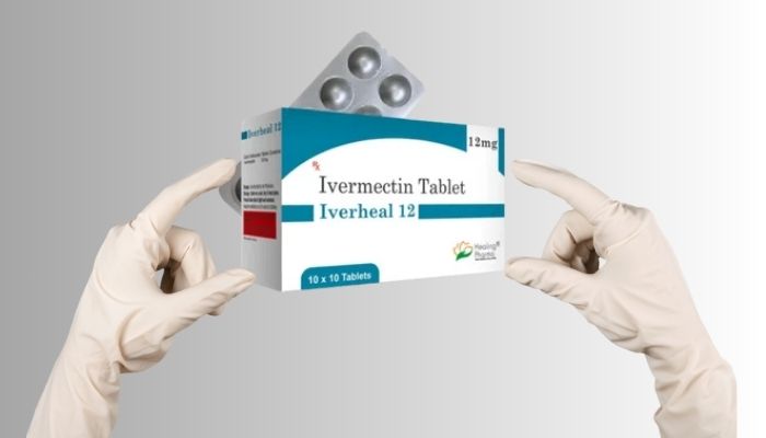 hands holding Ivermectin medicine