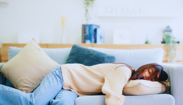 lady sleeping on couch